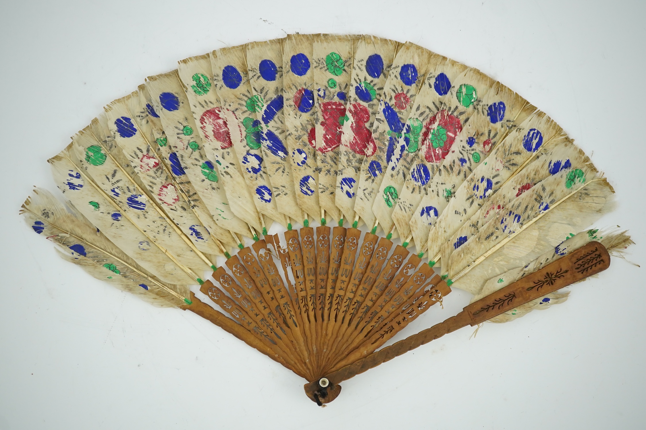 Three 19th century Chinese feather fans: One a carved bone brise black feather fan together with two similar carved sandalwood feather fans, two fans have hand painted decoration on the feathers both sides, the pink feat